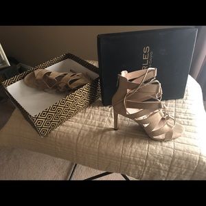 Beige/tan lace up gladiator heels.